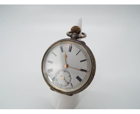 A lady’s silver cased pocket watch, case having engraved decoration, white enamel dial with Roman numerals, matched gold hand