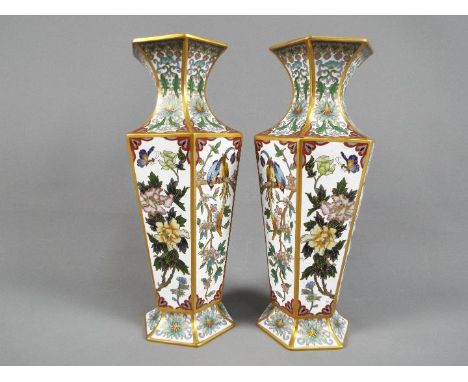 A pair of Chinese Zi Jin Cheng cloisonné hexagonal section vases, each panel of the main body decorated with flowers, birds a