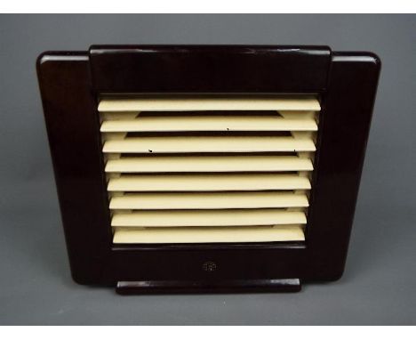 An Art Deco style extension speaker by Ekco, Type ES 31, dark brown Bakelite case with cream painted grille, for use with a r