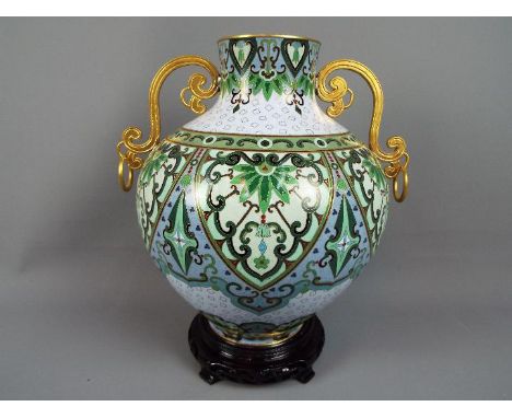 A large twin handled cloisonné vase of globular form, second half 20th century, with stylised floral motifs and scrolling dec