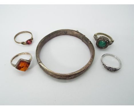 A small collection of jewellery to include silver hallmarked bangle, stone set ring stamped .925 and similar.