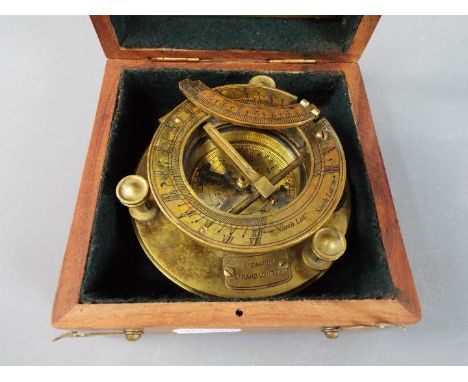 A boxed brass sundial compass marked J. H. Steward Ltd.