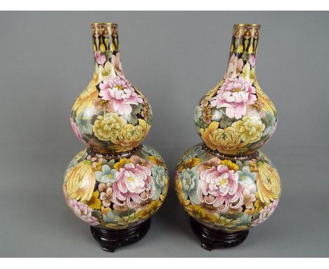 A large pair of Chinese double gourd cloisonné vases, decorated with chrysanthemum and other auspicious flowers, ruyi head ba