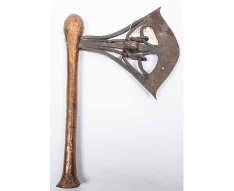 A good Songe ceremonial axe from Kasaye Province (S E Zaire), of Malela type, c 1880, the openwork wrought iron head with two