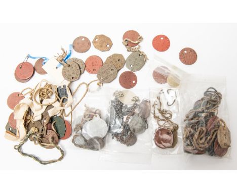 Approximately 50 mostly WWI fibre and metal "dog tags", including 20 to named regiments, some with original cords; also 9 ID 