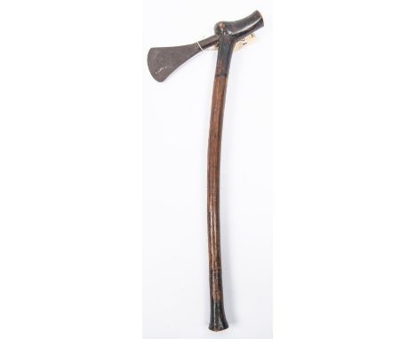 An African axe, with plain tapered head and hardwood haft, 20" overall. GC £20-30 