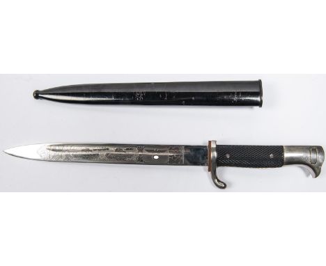 A Third Reich parade bayonet, the 9¾" blade with no maker's mark but etched on one side with eagles, tanks and oak leaves, an