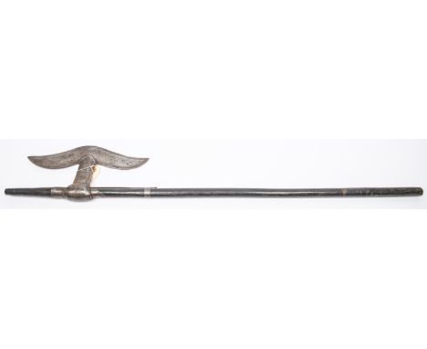 A 19th century Indian axe from Chota Nagpur, 34¼" overall, broad moustache shaped blade 10½", on its dark hardwood haft. GC £