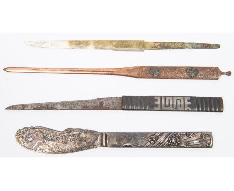 A kozuka, of plain ribbed iron with simple geometric silver inlay, with plain kogatana; another kozuka, embossed with monster