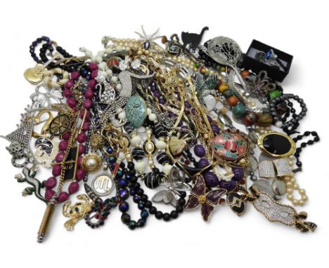 A large quantity of vintage costume jewellery including a butterfly enamel brooch marked Yve Saint Laurent YSL, other example