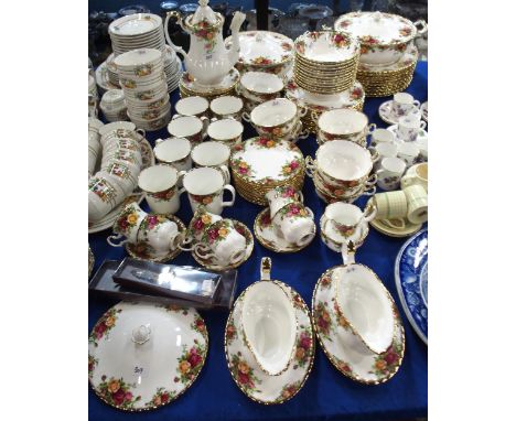 A Royal Albert Old Country Roses tea, coffee and dinner service comprising plates, tureens, bowls, coffee pot, cups and sauce