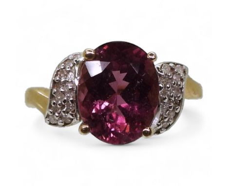 A 9ct gold garnet and diamond ring, size K, weight 2.9gms Condition Report:Available upon request