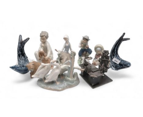 A pair of Ronneby of Sweden sealions, together with Lladro and Nao figures of children and animals and a metal sculpture made
