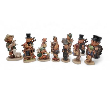 A collection of twelve Hummel figures and a money bank Condition Report:Available upon request