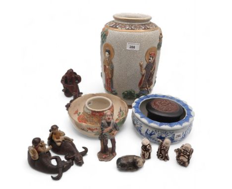 A Japanese Satsuma vase, a Satsuma jar and bowl, Chinese ceramic figures of children on buffalo, a carved figure of a fisherm