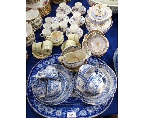 An antique blue and white platter decorated with figures in boats on a river before a bridge, a English blue and white teaset