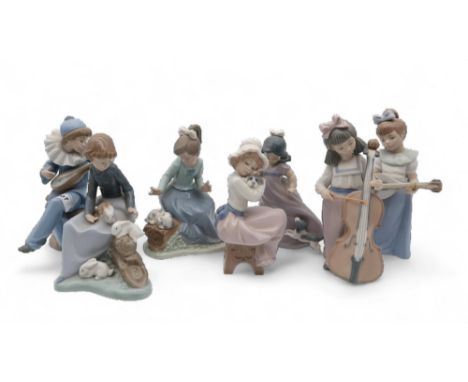 A collection of Nao figures of children together with a collection of Heredities and other figures Condition Report:Available