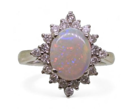 A 9ct white gold opal and diamond cluster ring, set with estimated approx 0.30cts. opal approx 10.1mm x 8.1mm x 3mm, finger s