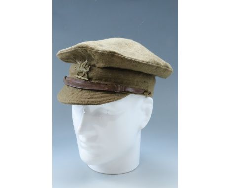 A Great War British army trench cap, bearing a 1st Monmouthshire Regiment badge