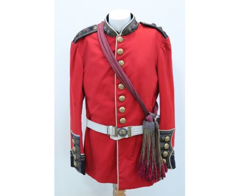 A Victorian Grenadier Guards lieutenant colonel's dress tunic with sash and buff leather sword belt, the tunic label bearing 