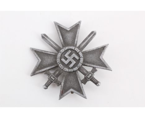 A German Third Reich War Merit Cross, first class, with swords, the pin stamped L/16