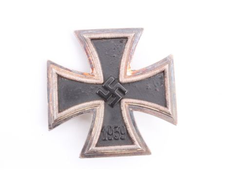 A German Third Reich Iron Cross first class, the pin stamped 26
