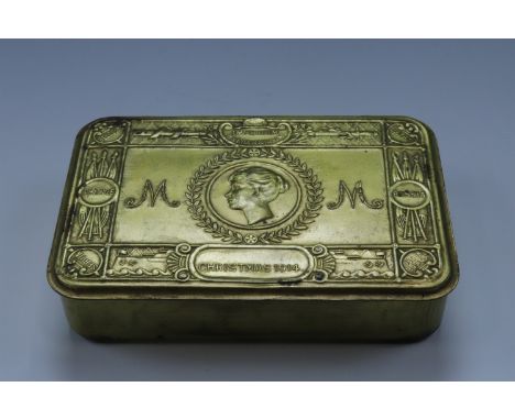 A 1914 Princess Mary gift tin together with a New Year card and Ordnance munitions worker's lapel badge