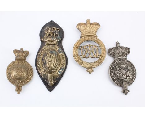 Four Victorian and later army saddlery martingale / breastplate and similar badges
