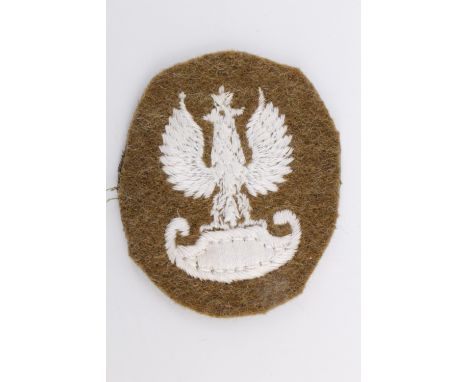 A Free Polish army machine embroidered cap badge, 42 mm
