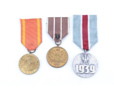 A Polish Army Medal of the War 1939-1945, a Medal For the participation in Defensive War 1939, and a Medal for Warsaw 1939-19