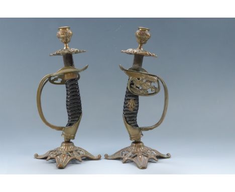A pair of candlesticks fabricated from Imperial German army OD 1889 infantry officers' sword hilts, 27 cm