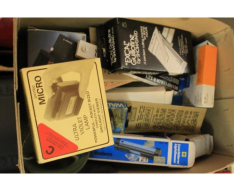 Box of stamps collectors accessories including mount cutter, UV lamp, safe watermark detector etc. 