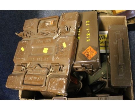 Box containing various ammunition, tins, spot light, military torch, turned steel spindles, ear muffs, etc. 