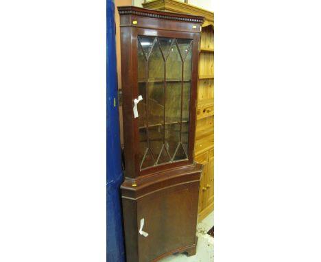 Reproduction mahogany astragal glazed corner cabinet on bracket feet. 