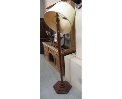 20th Century mahogany standard lamp with shade on hexagonal stepped base. 