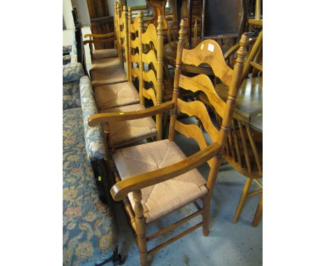 Set of four modern beech ladder back type dining chairs with rush seats together with a pair of similar ladder back carver ch