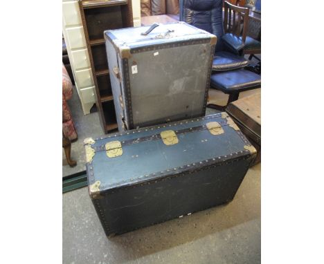 Two vintage brass and metal banded trunks together with another tin trunk. (3)