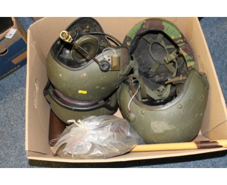 Assorted military helmets including three tank crew helmets, infantry helmets, officer's cap, swagger stick etc. 