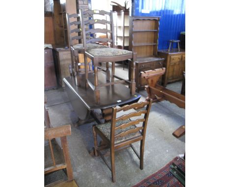 Mid 20th century oak refectory type drop leaf table together with a set of four ladder back upholstered chairs. (5)