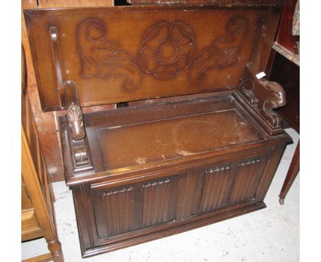 Reproduction oak carved monks bench. 