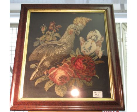 Framed and glazed tapestry depicting bird and floral scene. 