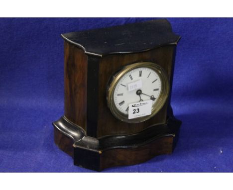 Late 19th century ebonized single train serpentine cased mantle clock with enamel face. 