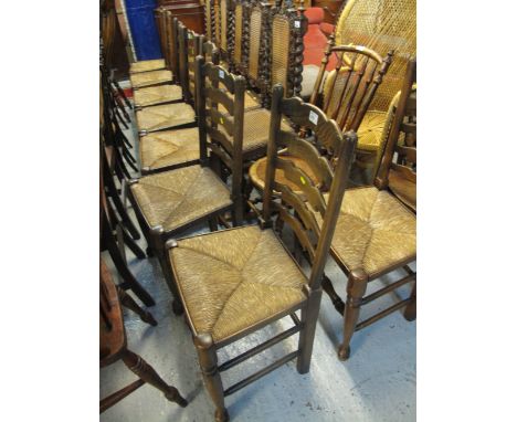Set of eight ladder back chairs with rush seats and baluster turned legs and supports. (8)