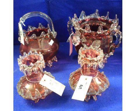 Four items of Victorian cranberry glass to include baluster shaped two handled biscuit barrel (lacking cover), baluster shape