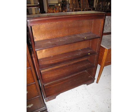 Mahogany four section open book shelves on bracket feet. 