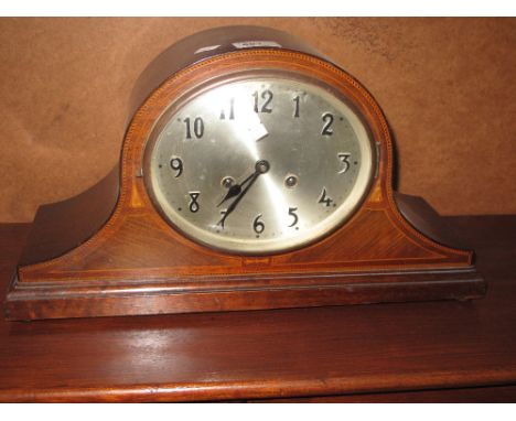 Edwardian mahogany inlaid two train hat shaped mantle clock on bun feet. 