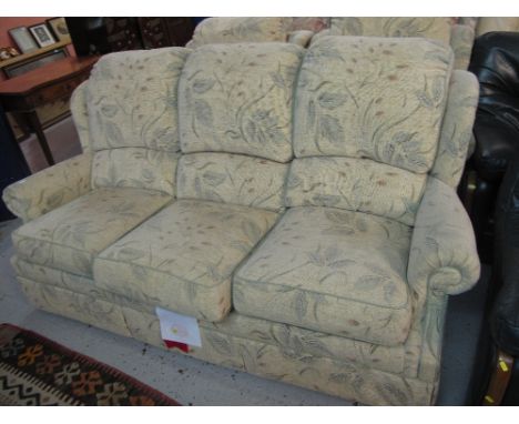 G-plan foliate upholstered three piece suite comprising three seater sofa and two matching armchairs. (3)