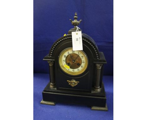 Late 19th century black slate and gilt metal mounted two train architectural mantle clock with French brass drum movement. 