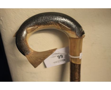 Rustic shepherd's crook type walking stick with carved rams horn handle in the form of a leaping salmon.  CONDITION REPORT: N