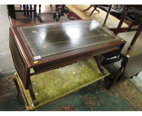 Reproduction mahogany sofa type table with leather inset top on metal claw feet and casters. 